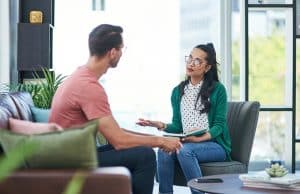 A person participates in therapy at a drug rehab.