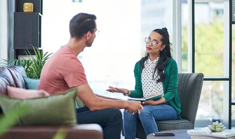 A person participates in therapy at a drug rehab.