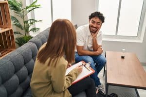 A man participates in therapy as part of a dual diagnosis treatment plan.