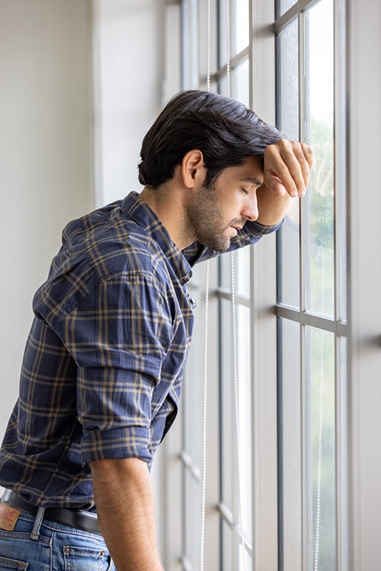 A man struggles with alcohol addiction.