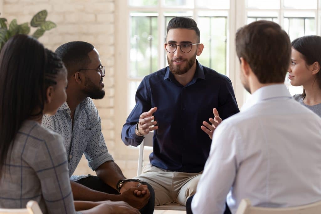 People participate in group therapy at a fentanyl treatment center.