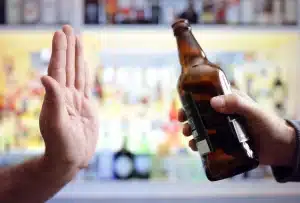 A person avoids peer pressure to use alcohol.