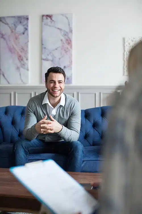 A person participates in therapy at prescription drug addiction treatment center.