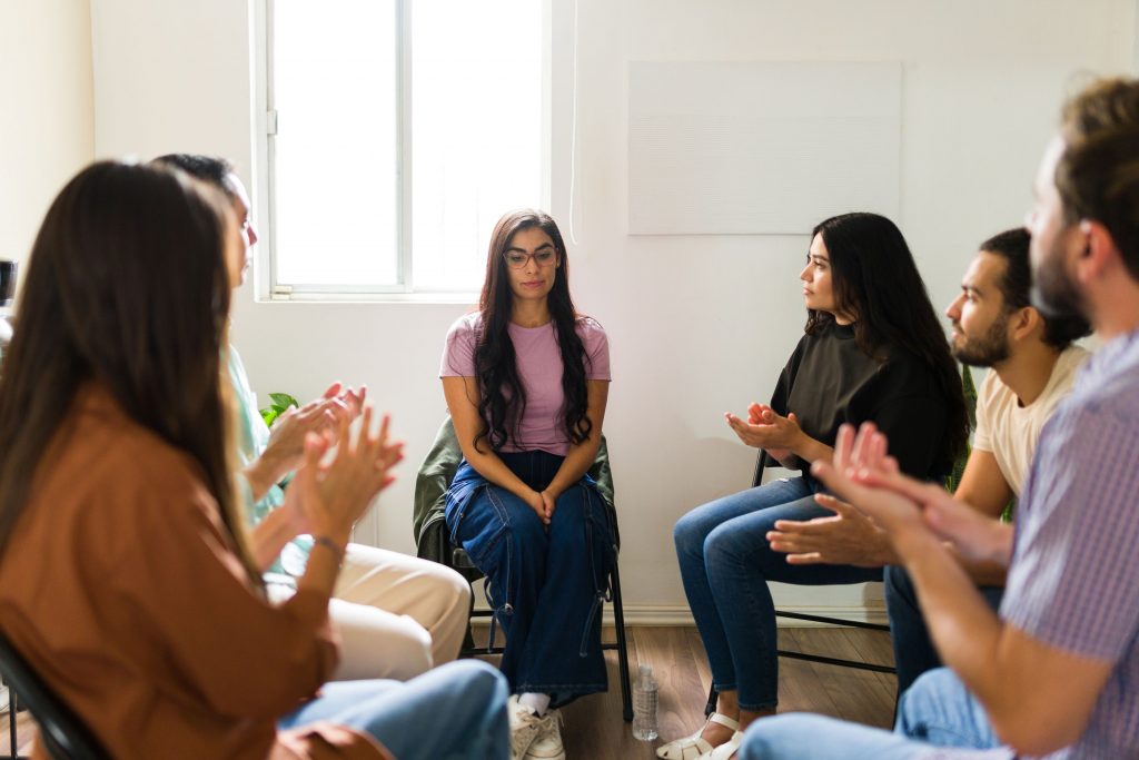 Women supporting each other at a long beach rehab.